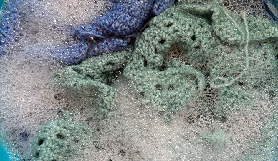 Crochet pieces in foamy water