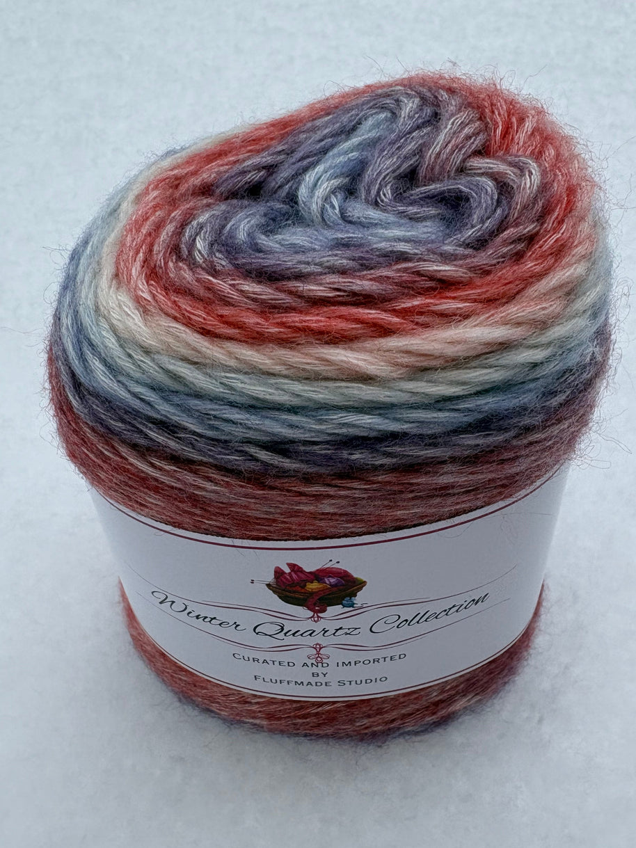 Multicolored yarn skein with a label on a white background