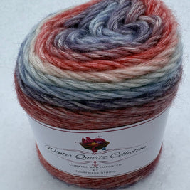 Multicolored yarn skein with a label on a white background