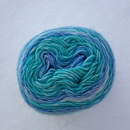 Blue and green skein of yarn on a white background