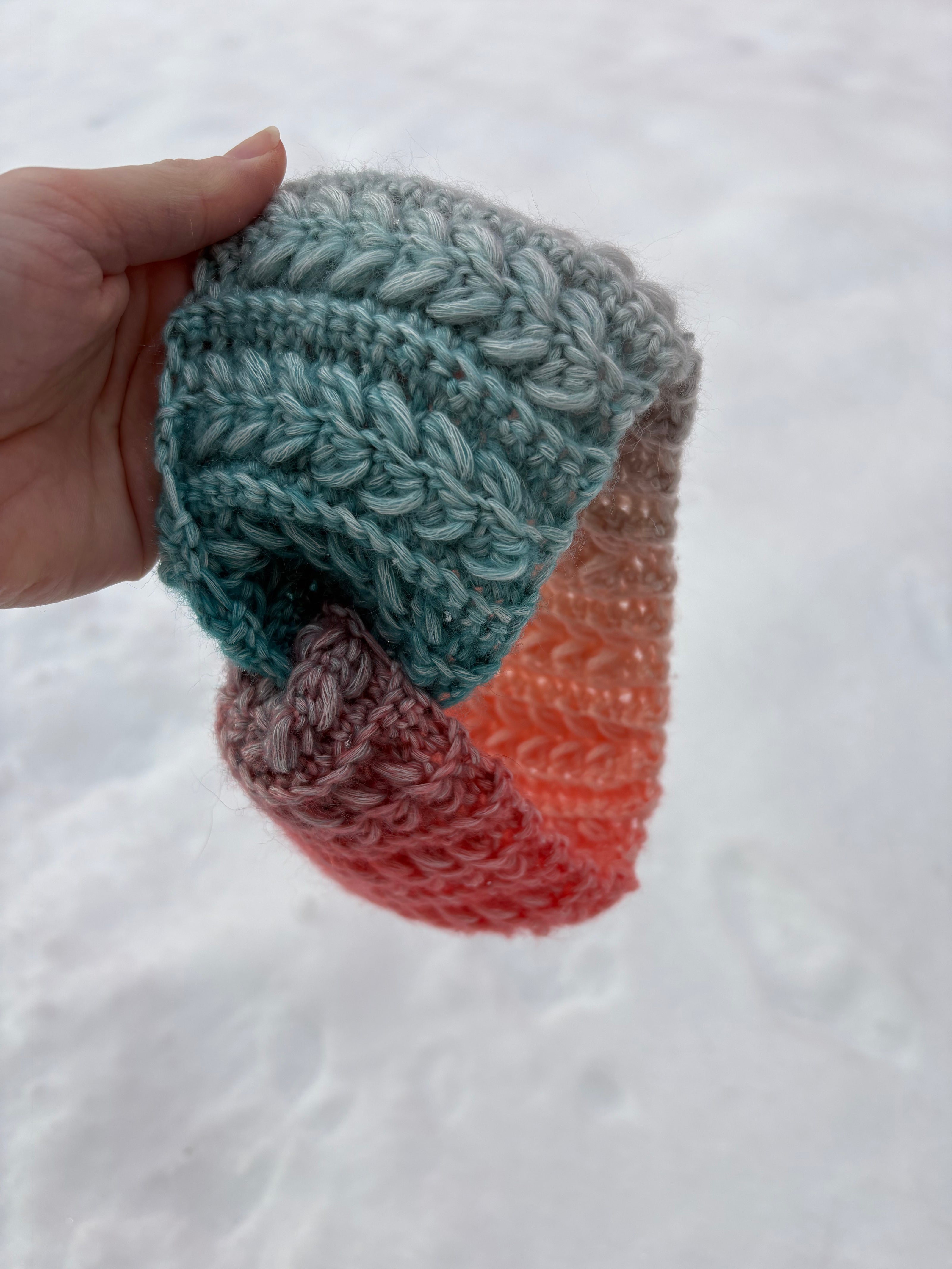 Teal and coral gradient crochet headband with braided stitch texture – Fluffmade Solstice Ear Warmer.