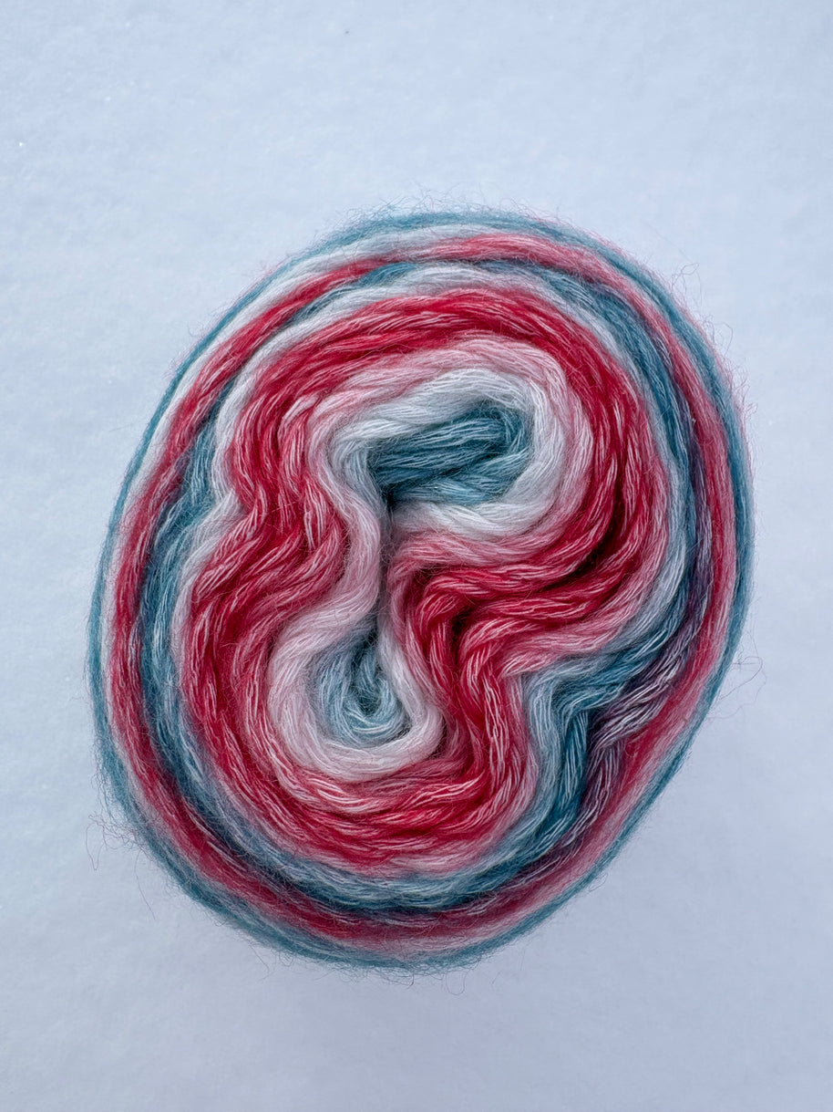 Multicolored yarn skein on a light gray background