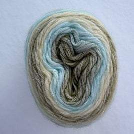 Multicolored green yarn skein on a light gray background