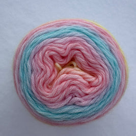 Multicolored pink, blue and yellow yarn skein on a light gray background