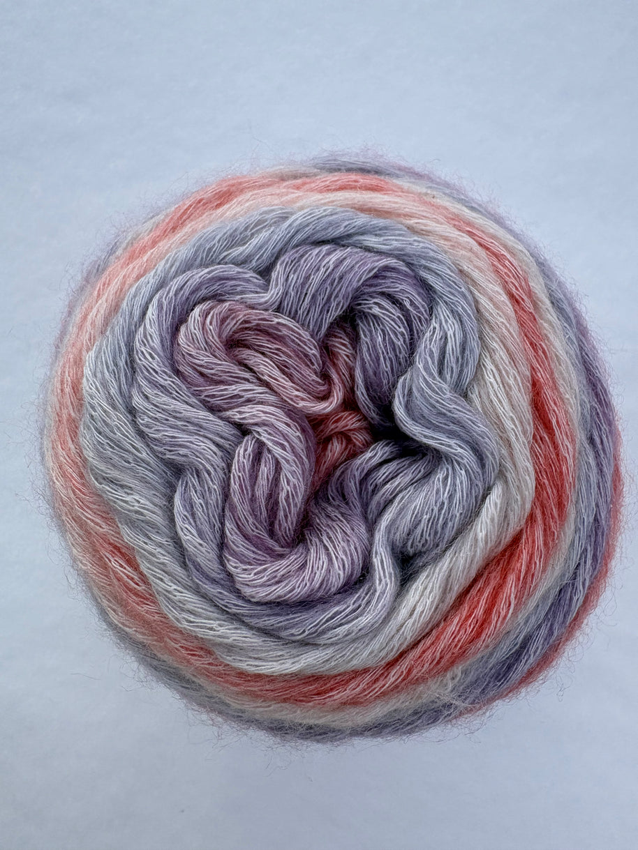 Multicolored yarn skein on a light gray background