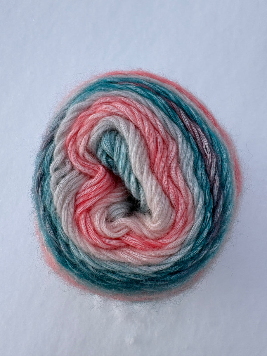 Multicolored yarn skein on a light gray background